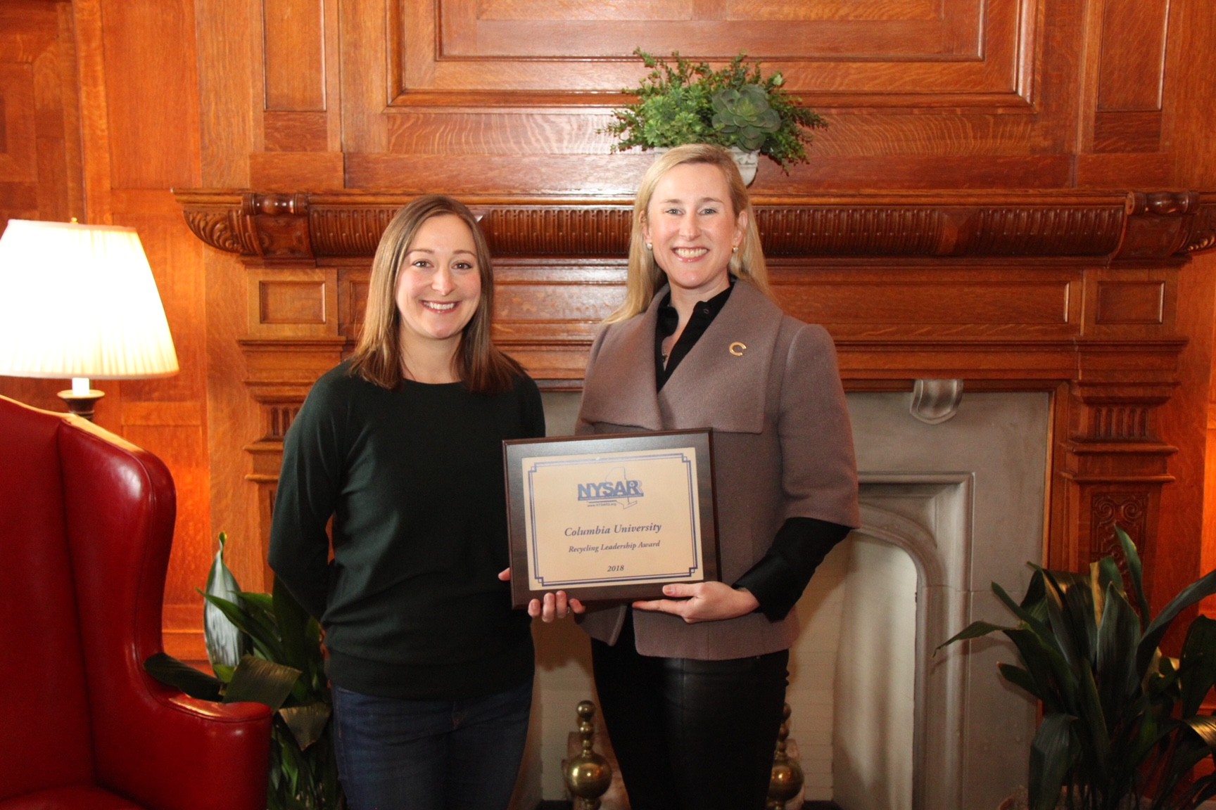 Jessica Prata, Assistant Vice President of the Office of Sustainability for Columbia University, (right) is presented with the 2018 Recycling Leadership Award-College or University by NYSAR3 President Kelli Timbrook.