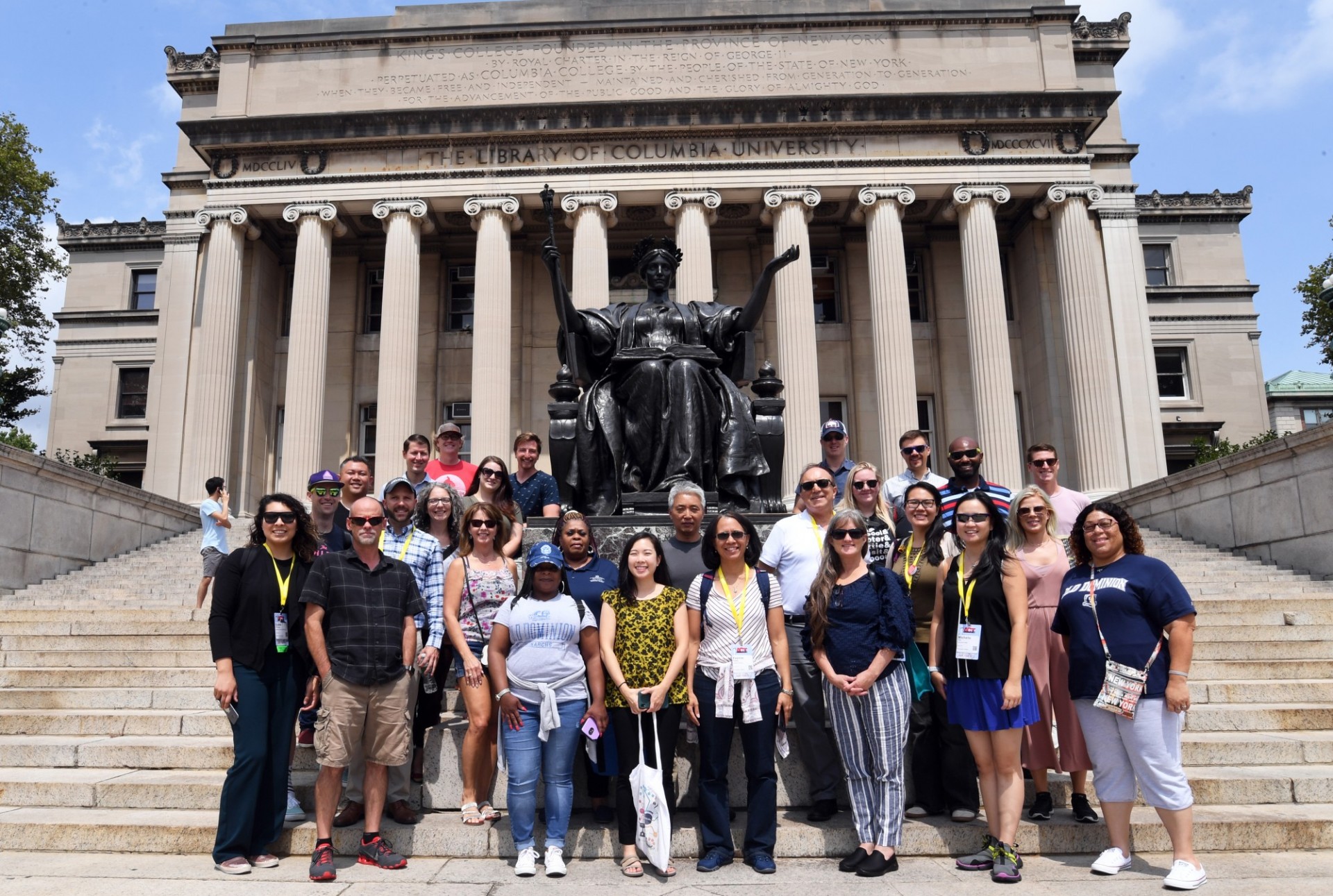 Tour group posing in front of Alma Mater on Columbia's Morningside campus