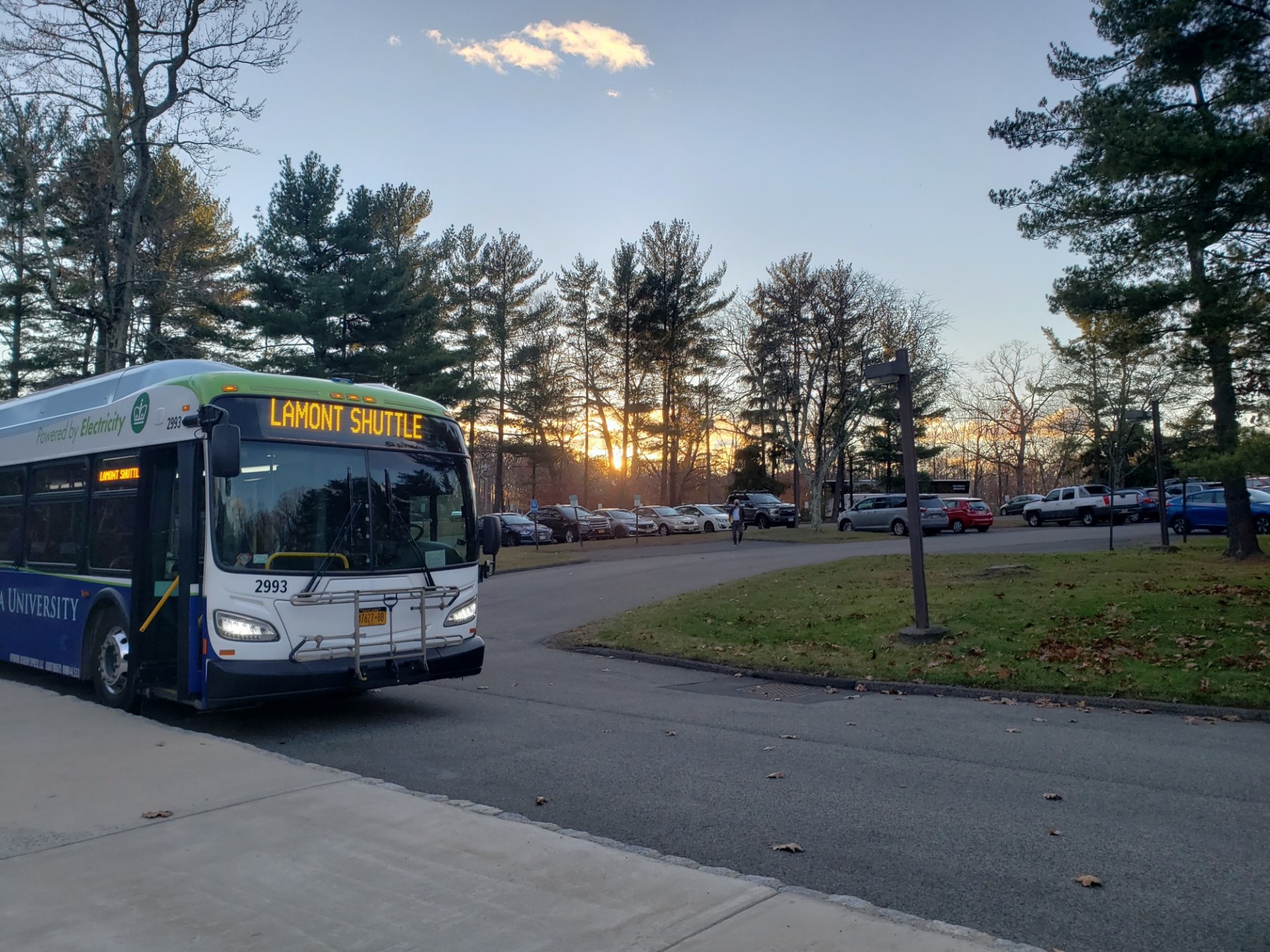 The Lamont shuttle is parked in front of the parking lot at Lamont-Doherty campus on a clear winter evening