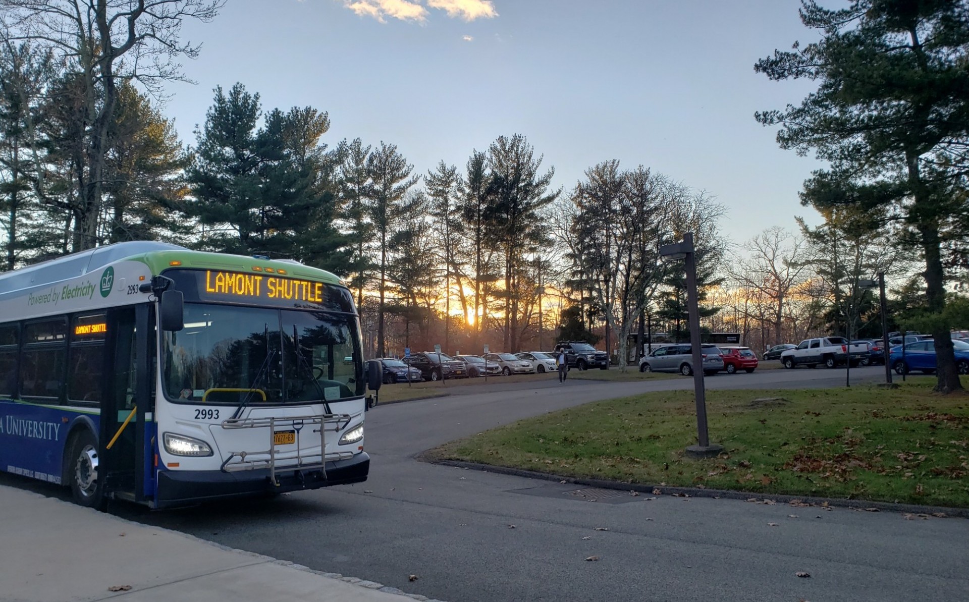 Lamont shuttle waits in parking lot for riders to board the bus