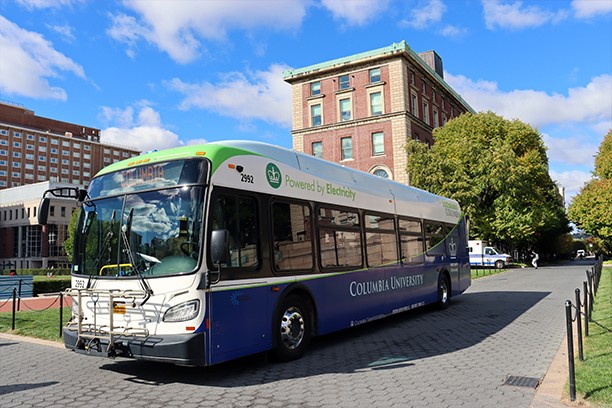 Columbia's electric shuttle bus is parked on College Walk