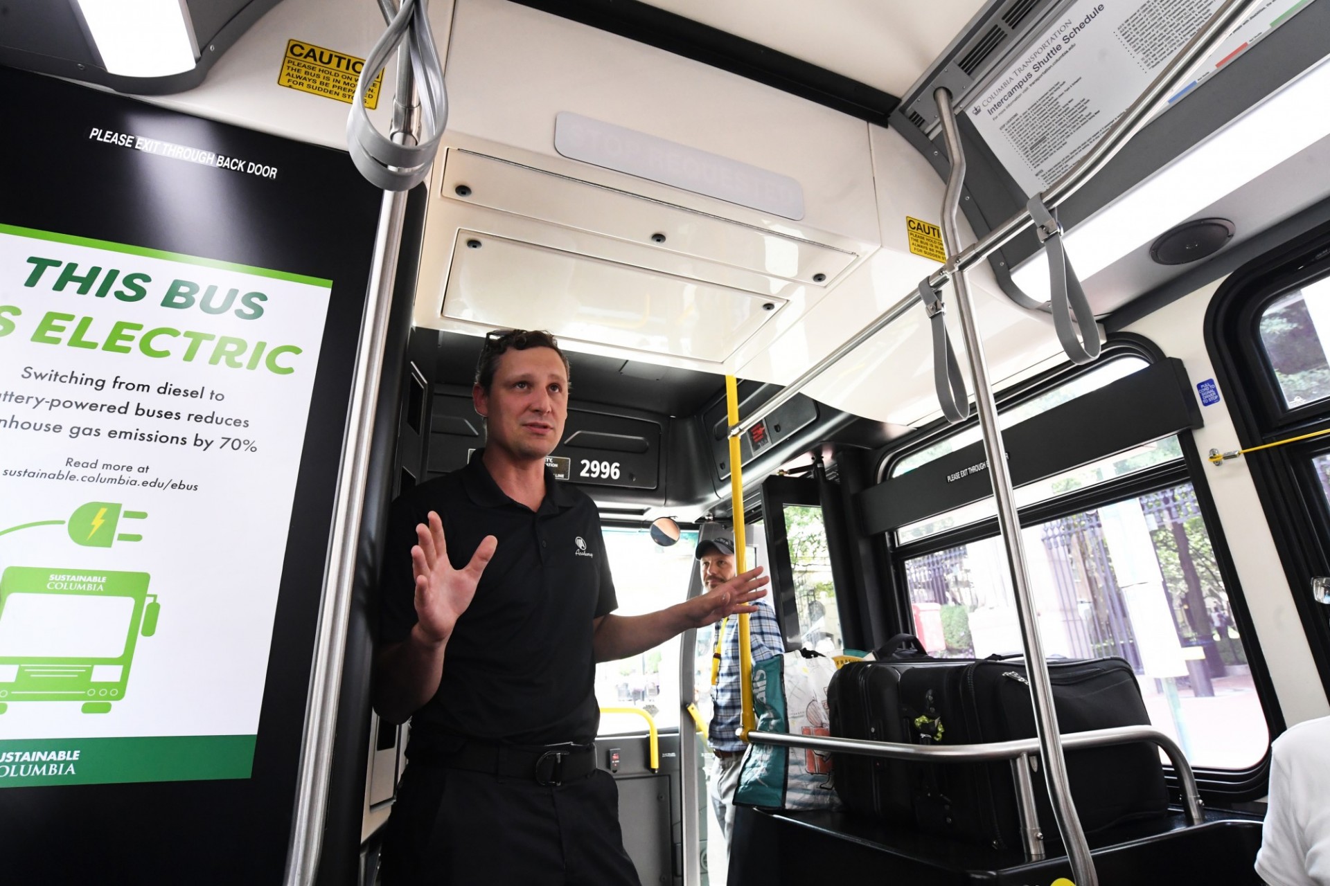 Academy rep giving information on the bus