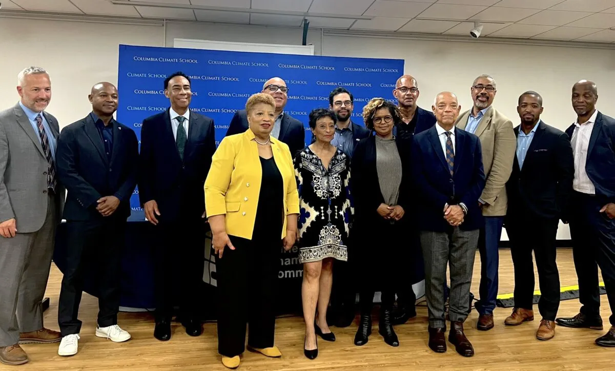 Panelists pose for a photo at the event