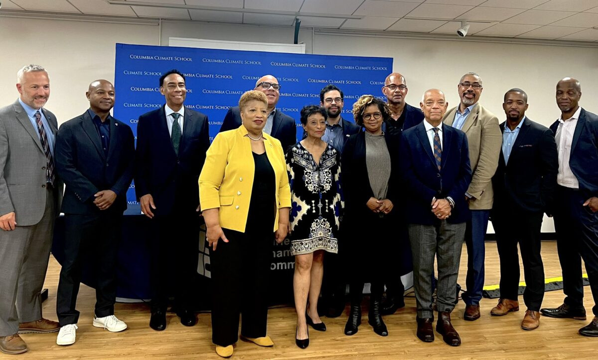 Panelists pose for a photo at the event