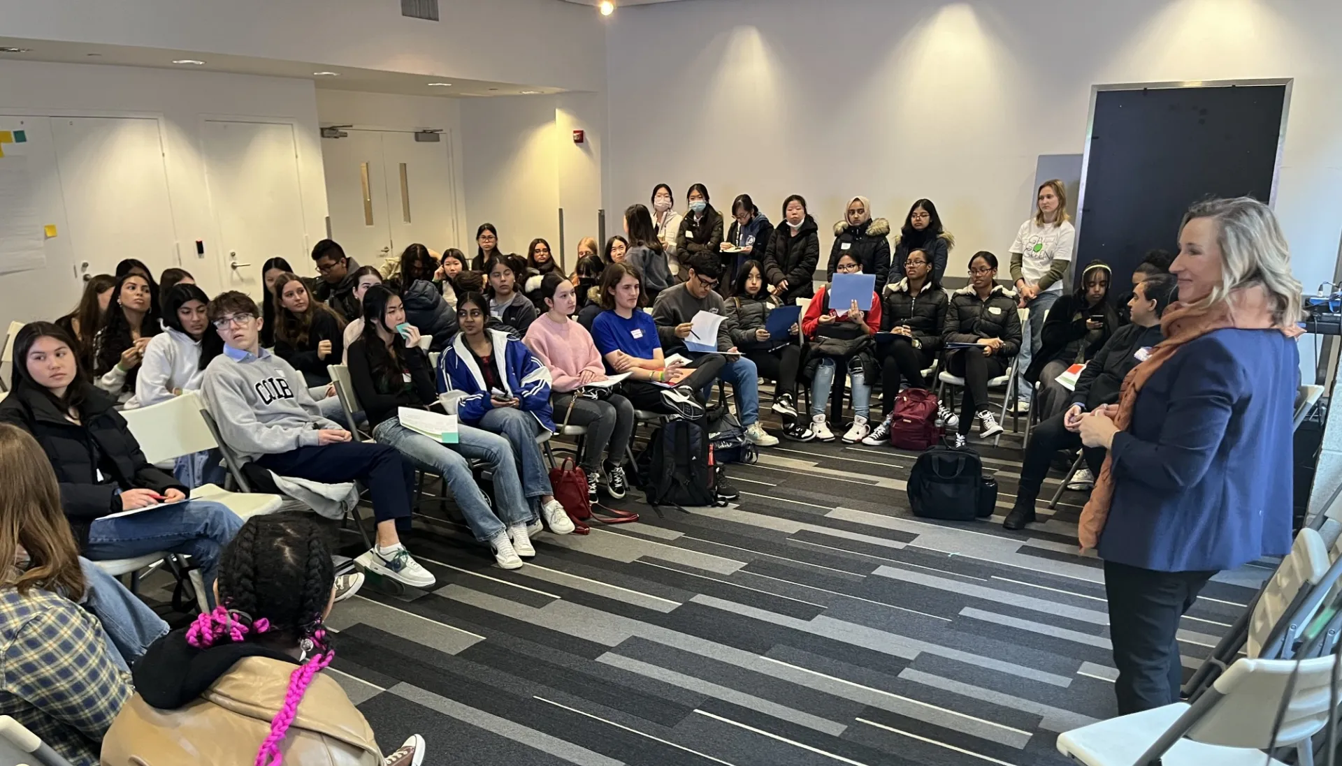 Jessica presents to a room of students