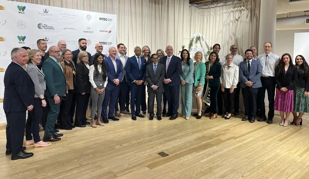 Attendees pose for group photo