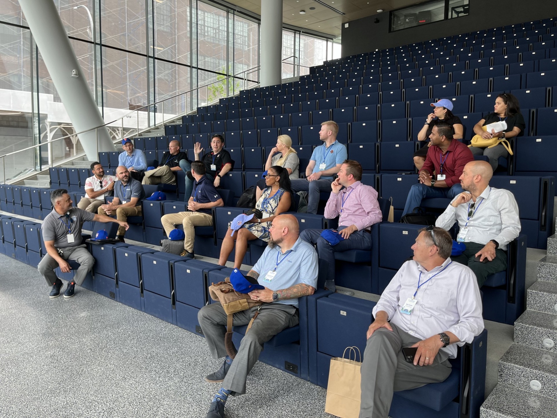 Conference attendees sit in seats in a lecture hall at the new Columbia Business school