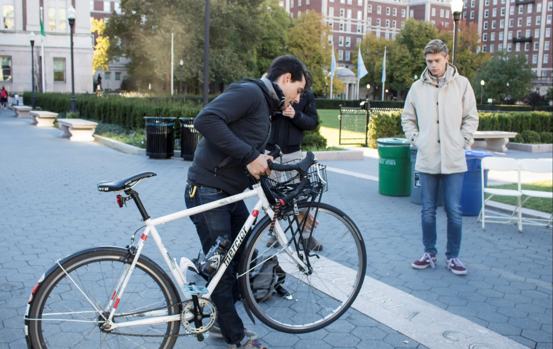 Person holding bicycle on Morningside campus