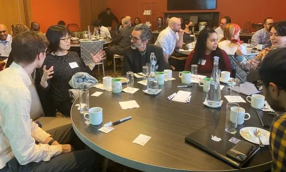 Attendees begin initial discussions