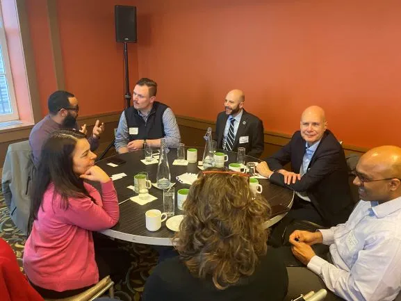 Dan Allalemdjian sits with participants to discuss the initiative