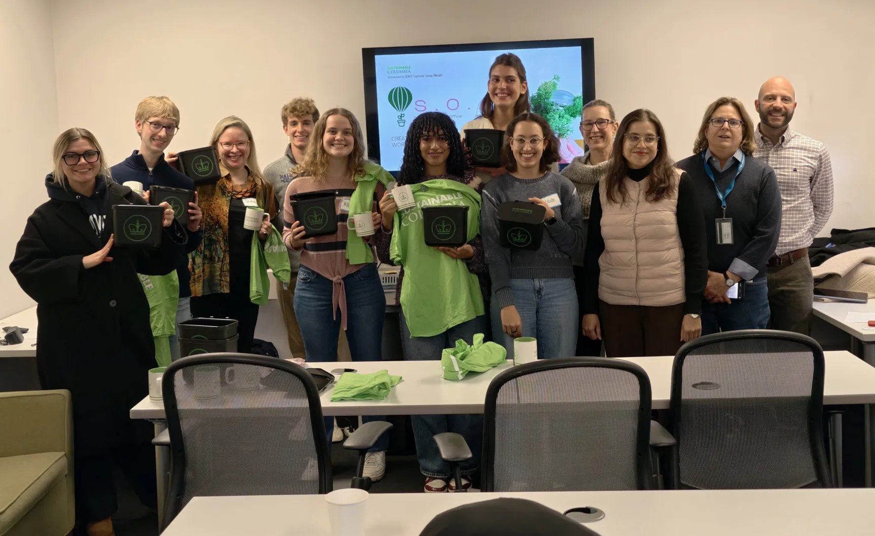 The capstone team poses with members of the Sustainability office