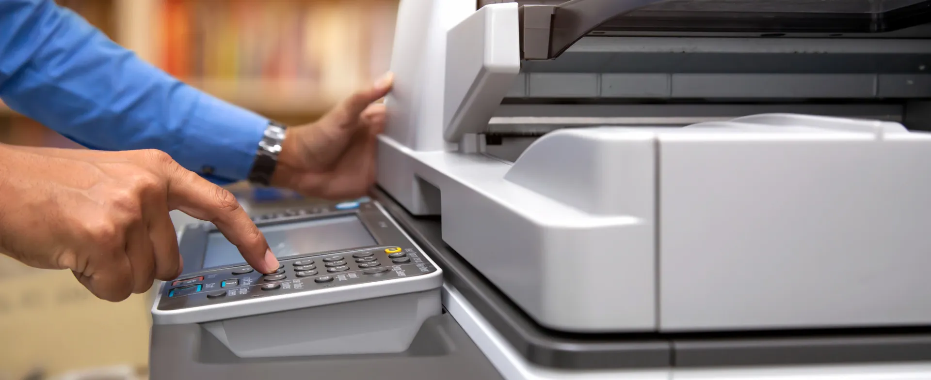 Someone using a printer copier machine